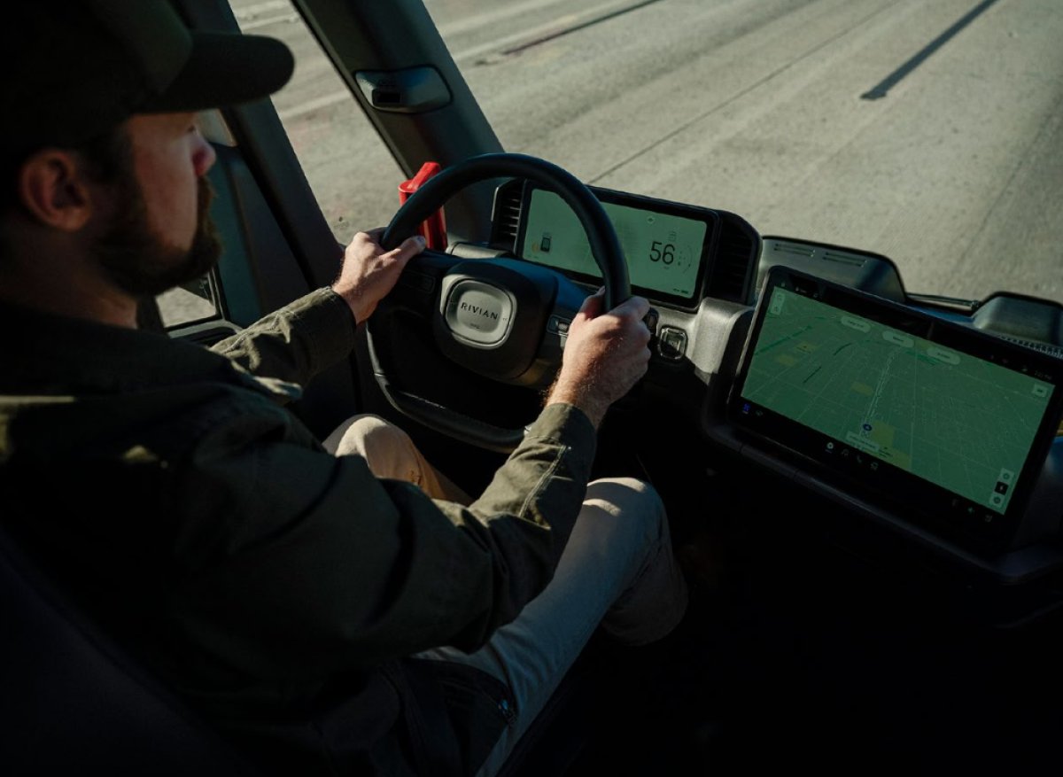 The interior of the RCV, with Rivian's 2-screen layout.